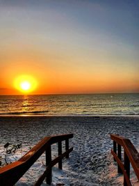 Scenic view of sea against orange sky