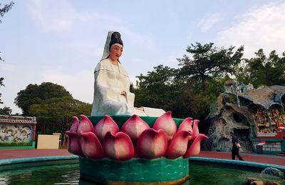 Full length of woman with ice cream against sky