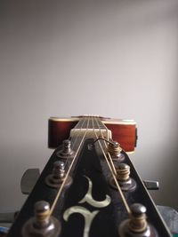 Close-up of guitar on table