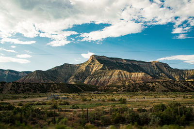 Scenic view of landscape and mountains against sky