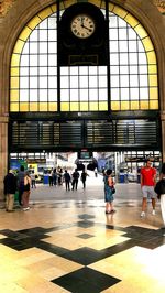 People walking at railroad station