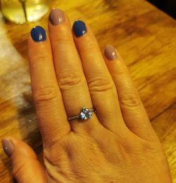 Close-up of woman hand on table