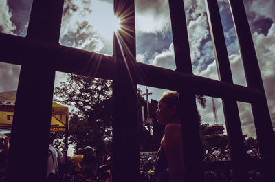 Low angle view of child on window