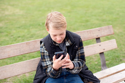 Teenage boy using smartphone