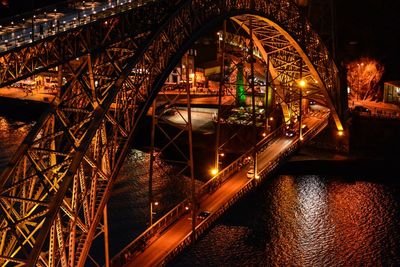 Illuminated bridge at night