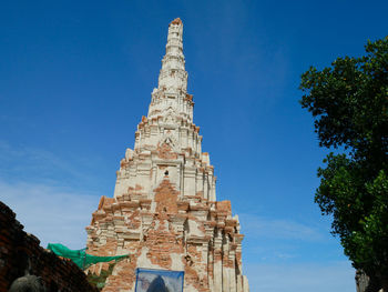 Low angle view of building against blue sky