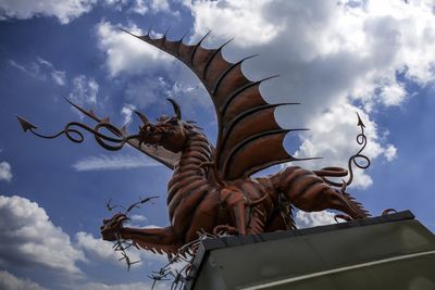 Low angle view of statue against sky