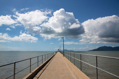 Pier over sea against sky