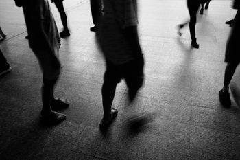 Low section of people walking on street