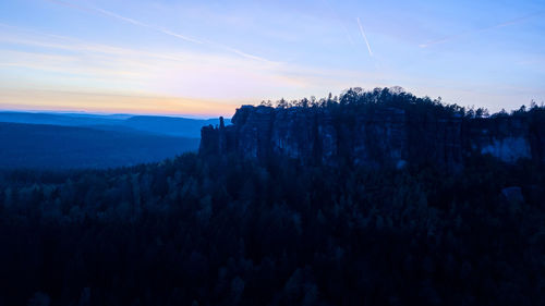 Scenic view of mountains against sky during sunset