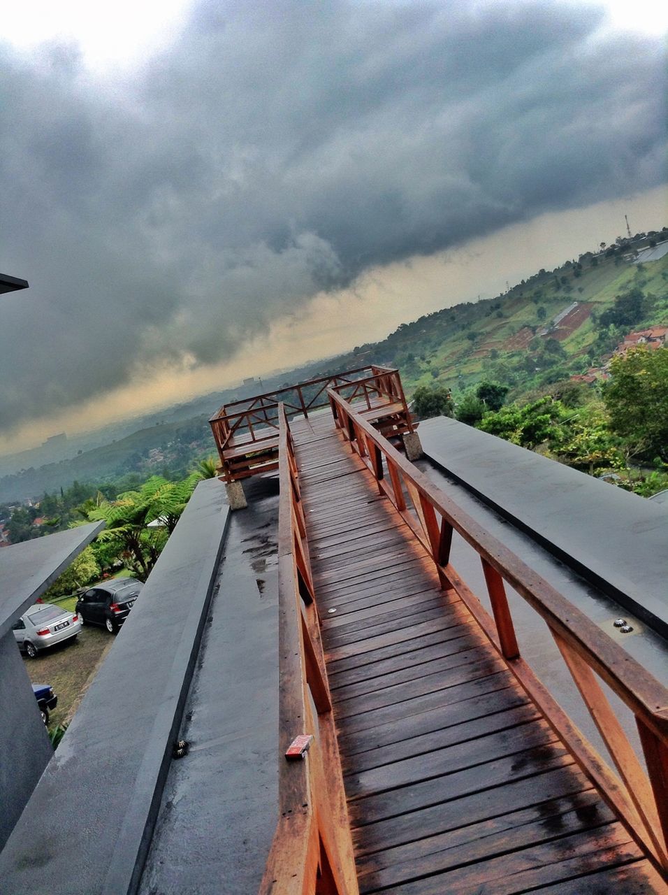 PANORAMIC VIEW OF PIER ON MOUNTAINS AGAINST SKY