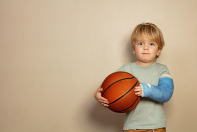 Boy playing basketball at home