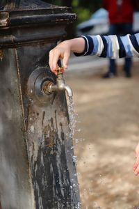 Close-up of hand holding water fountain