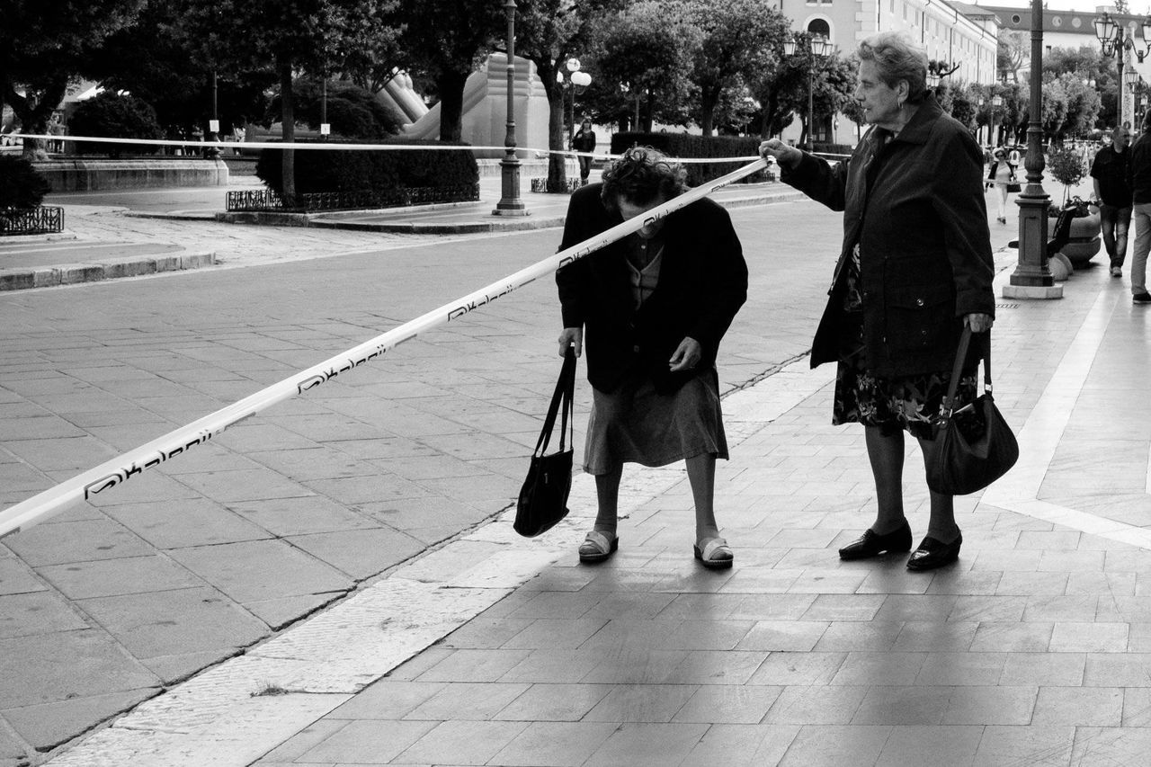 real people, walking, full length, togetherness, women, leisure activity, men, lifestyles, tree, day, outdoors, two people, built structure, girls, childhood, bonding, architecture, city, warm clothing, adult, people