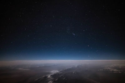 Scenic view of landscape against sky at night