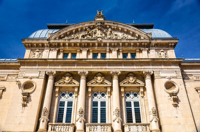 Low angle view of historical building against blue sky