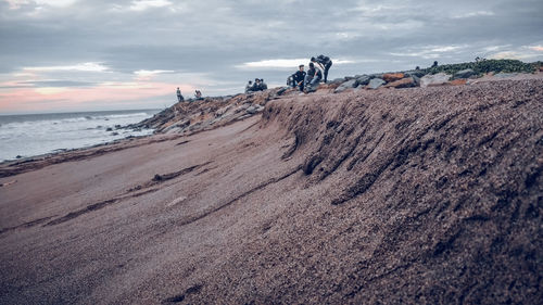 Panoramic view of beach against sky during sunset