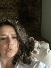 Portrait of woman with cat