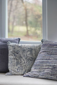 Close-up of curtain on window at home