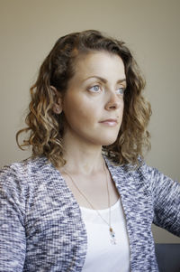 Portrait of woman against white background