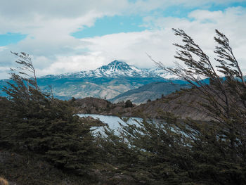Scenic view of snowcapped mountains against sky