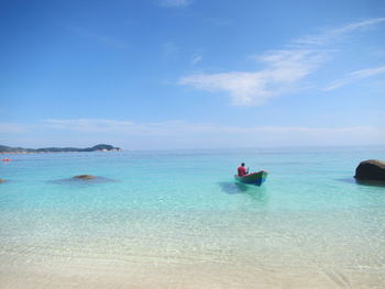 Scenic view of sea against blue sky