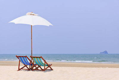 Lifeguard hut on beach against clear sky