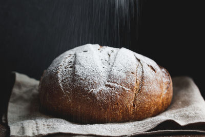 Close-up of bread on textile