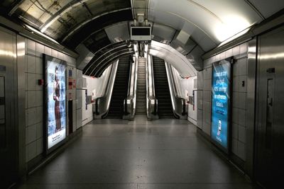 Corridor against escalator at subway station