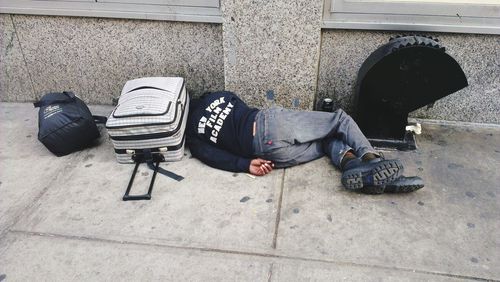 Low section of man sitting on floor