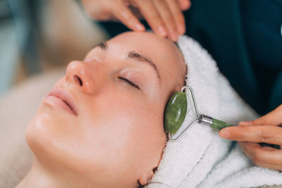 Woman lying for beauty treatment at spa