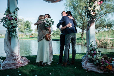 Young couple holding flower bouquet