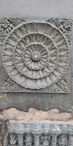 Close-up of sculpture against wall