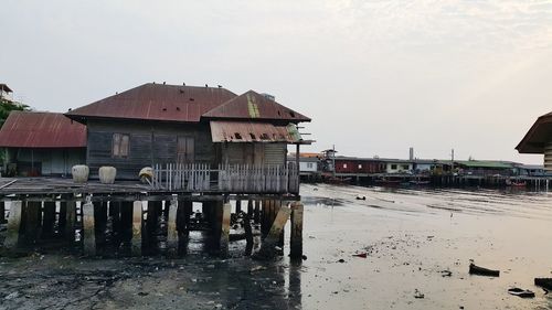 Built structure on beach against clear sky