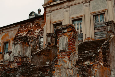 Low angle view of old building against sky