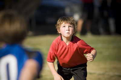 Determined young boy ready to head a soccer ball