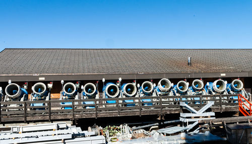 Graffiti on roof against clear blue sky