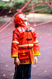 Midsection of child standing on street