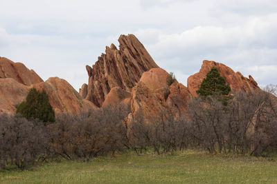 Low angle view of rocks against sky