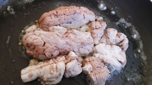 High angle view of meat on barbecue grill