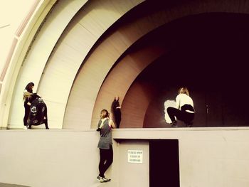 Man and woman walking in corridor of building