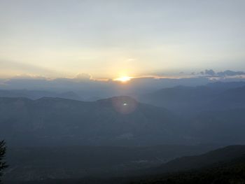Scenic view of mountains against sky during sunset