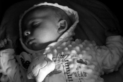 Close-up portrait of cute baby sleeping