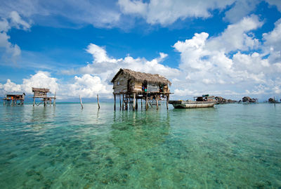 Scenic view of sea and buildings against sky