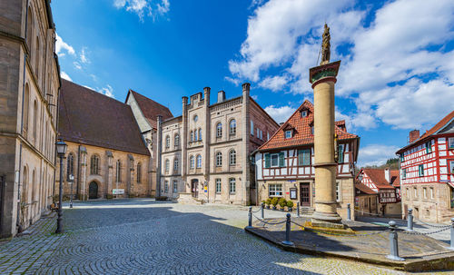 Buildings in city against sky