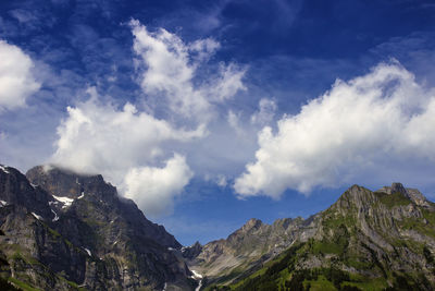Low angle view of mountain range against sky
