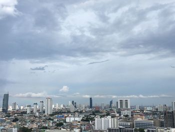 Modern buildings in city against sky