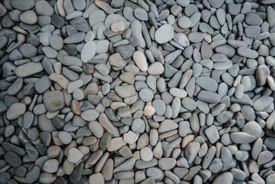 High angle view of stones on pebbles