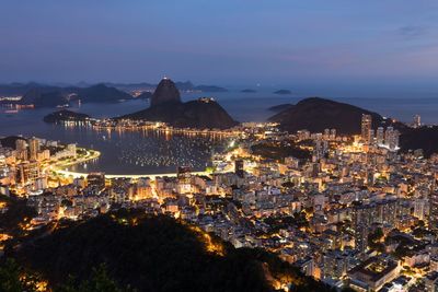 High angle view of illuminated city at night