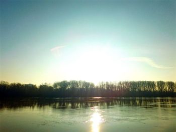 Scenic view of lake at sunset